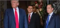  ?? KEVIN D. LILES, NYTFILE PHOTO ?? Michael Flynn, centre, Donald Trump and Reince Priebus in Dec. 2016.