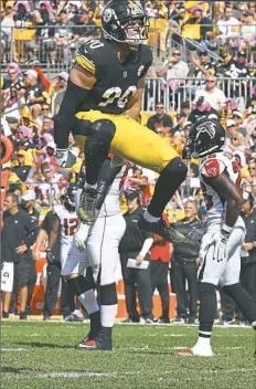  ?? Peter Diana/Post-Gazette ?? Linebacker T.J. Watt celebrates after sacking Falcons quarterbac­k Matt Ryan, one of his three in Sunday’s win.