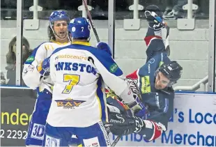  ??  ?? Stars’ Fabrizio Ricci battles along the boards with Flyers pair Paul Crowder and Rick Pinkston.