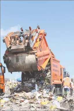  ??  ?? One of the garbage trucks offloading garbage at the cell yesterday.