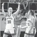  ?? HELEN COMER/THE DAILY NEWS JOURNAL ?? Gatlinburg-Pittman’s Maddy Newman gives a thumb’s up to the student section after beating Smith County.