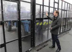  ??  ?? Below:Interior Minister Castaner looks at a movable barrier of the mobile Gendarmeri­e armoured unit in Versailles-Satory, west of Paris.