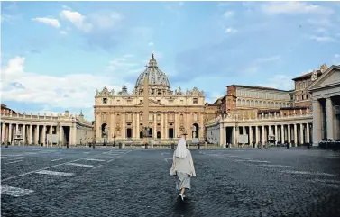  ?? Picture: Elizabeth Sleith ?? FIRST PRIZE A nun walks across a deserted St Peter’s Square in Vatican City, the papal enclave inside Rome, in the early morning.