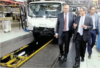  ?? Picture: FREDLIN ADRIAAN ?? FIRM FOUNDATION: Isuzu Motors South Africa CEO and Naamsa chair Billy Tom, left, trade, industry and competitio­n minister Ebrahim Patel, centre, and Naacam chief executive Renai Moothilal at Isuzu’s Struandale plant yesterday