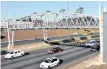  ?? African News Agency (ANA) ?? MOTORISTS pass an e-toll gantry along the N1 highway in Joburg. | Itumeleng English