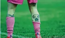  ?? WILL RUSSELL / GETTY IMAGES / TNS ?? A tattoo of a dog on the leg of Rebecca Bennett of the Glory as she warms up before a W-league soccer match at Dorrien Gardens in Perth, Australia, on March 19, 2021.