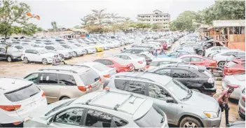  ?? — AFP photo ?? Second hand cars are seen on display at a dealer in Ekpe, Benin.