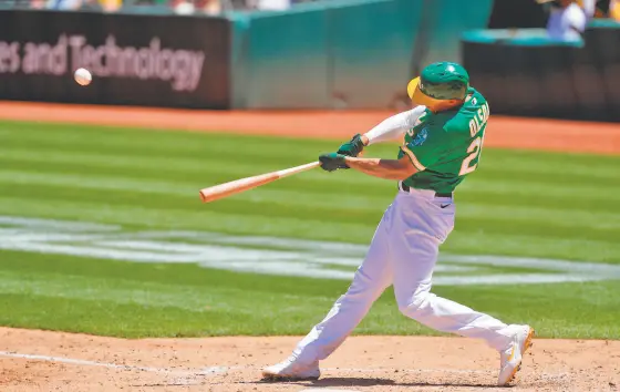  ?? Carlos Avila Gonzalez / The Chronicle ?? The A’s Matt Olson, homering against the Royals on June 13, has a .988 OPS, which would be his career high over a full season.