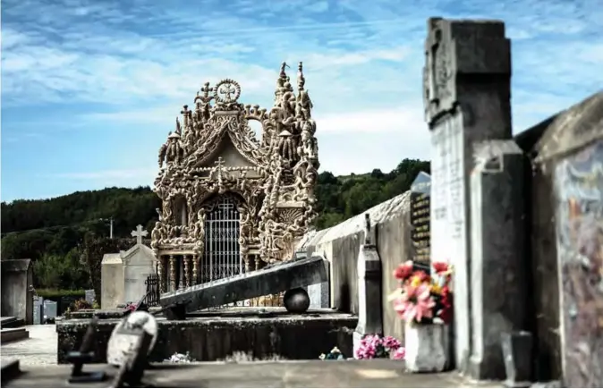  ??  ?? The tomb (center background) of French postman Ferdinand Cheval, better known as Facteur Cheval, is pictured in Hauterives. — AFP