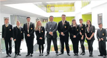  ??  ?? The new head at Aberdare Community School Mark Powell, who was appointed last year, with pupils