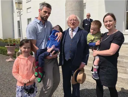  ??  ?? Les and Linda Martin with their children Ciaran, Cathal and Holly and President Michael D. Higgins last year.