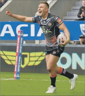  ?? PICTURE: STEVE RIDING ?? NO STOPPING HIM: Greg Eden celebrates one of his hat-trick of tries against Leeds.