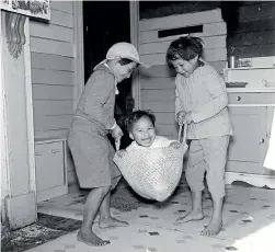  ??  ?? The happy boy being swung in the kete is from the Washday at the Pa series.