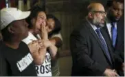  ?? HARRISON JONES — PITTSBURGH POST-GAZETTE VIA AP ?? Michelle Kenney, second from left, mother of Antwon Rose Jr., reacts as attorney Fred Rabner addresses reporters at the Allegheny County Courthouse in Pittsburgh, Wednesday. At left is Atwon Rose, father of Antwon Jr. Michael Rosfeld, a white police...