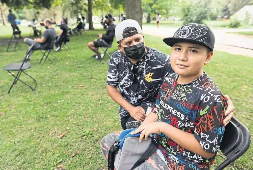  ?? RICHARD LAUTENS TORONTO STAR ?? Michael Castro, 12, got his first vaccine in Trinity Bellwoods so he could go to his boxing class. Michael was taken to the clinic by his dad, Eric.