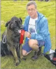  ?? FM4398538 ?? A first for Chris Rogers and dog Basil in the Best Rescue class