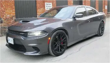  ?? Lesley Wimbush
/ Driving ?? The regular Charger’s grille is already aggressive, but the Hellcat looks even more
malevolent with a blacked-out fascia and gaping brake ducts and front splitter.