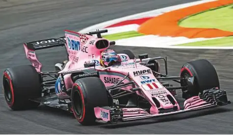  ?? Rex Features ?? Sergio Perez of Sahara Force India F1 Team in Monza, Italy. As Mallya celebrates the 10th anniversar­y of acquiring the struggling Spyker F1 team, the renamed Sahara Force India, has also taken giant strides. They have secured the fourth position in the...