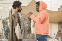  ?? SONY PICTURES ?? LaKeith Stanfield, left, stands with director Jeymes Samuels on the set of“The Book of Clarence.”