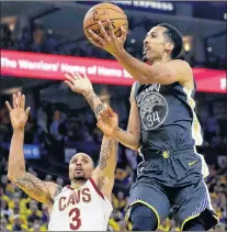  ?? AP PHOTO ?? Golden State Warriors’ Shaun Livingston shoots against Cleveland Cavaliers’ George Hill during Game 2 of the NBA Finals Sunday in Oakland, Calif.