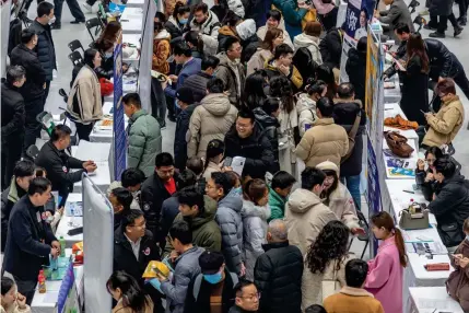  ?? AFP PHOTO ?? BOLSTERING
People attend a job fair in Zhengzhou, in China’s Henan province on Feb. 19, 2024. China’s Ministry of Finance on May 13, 2024 announced it will begin selling the first batch of long-dated bonds this week to support its economy.