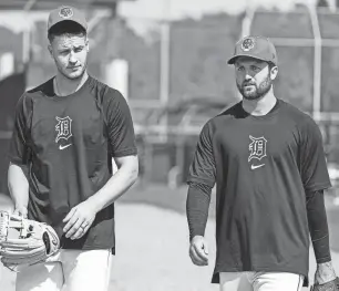  ?? JUNFU HAN/DETROIT FREE PRESS ?? Tigers pitchers Matt Manning and Casey Mize practice during spring training at Tigertown in Lakeland, Florida, last month.