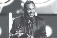  ?? ASSOCIATED PRESS FILE PHOTO ?? Kendrick Lamar accepts the award for best rap album for “Damn.” at the 60th annual Grammy Awards in January in New York. On Monday, Lamar won a Pulitzer Prize for the same album.