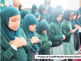  ??  ?? &gt; Prayers at Cardiff Muslim Primary School