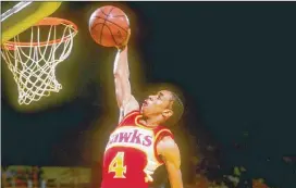  ?? STEPHEN DUNN /ALLSPORT ?? Hawks guard Spud Webb’s final dunk in the 1986 contest might have been his best: He bounced the ball off the court, onto the backboard and into his right hand before slamming it in. The judges gave the 5-foot-7 dynamo a 50.