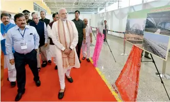  ?? PTI ?? Prime Minister Narendra Modi visits an exhibition after the inaugurati­on of the integrated terminal building at Harni airport, in Vadodara, on Saturday. —