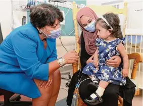  ?? André Coutu/CHEO via Associated Press ?? Ayla Bashir and her mother, Sobia Qureshi, meet with Dr. Karen Fung Kee Fun, left, of the Ottawa Hospital, for an infusion treatment.