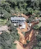  ?? Picture: Orrin Singh ?? A ravine opened beneath this house in Umdloti, north of Durban, in this week’s floods.