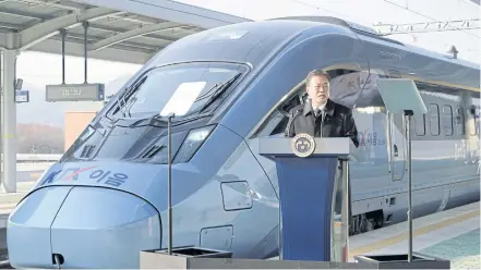  ?? YONHAP VIA REUTERS ?? South Korean President Moon Jae-in delivers a speech during a ceremony marking a trial run of the KTX-Eum, an electric multiple unit train, at the Wonju Station in Wonju, Gangwon province yesterday.