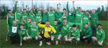  ??  ?? Kiltealy Celtic captain Ben Nugent and his team-mates celebrate after clinching the Division 5 crown.