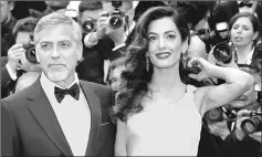  ??  ?? Clooney and his wife Amal attend the 69th Cannes Film Festival in Cannes, France on May 12, 2016. — Reuters file photo