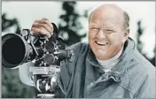  ?? Warren Miller Co. ?? IN HIS ELEMENT Warren Miller, shown with his tools of the trade, made copious films about various outdoor activities.