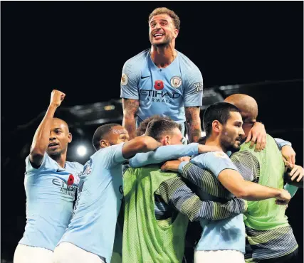  ?? Picture: Nick Potts/PA ?? Manchester City’s Ilkay Gundogan, second right, is mobbed by his Manchester City team-mates after scoring his side’s third goal in the win against Manchester United at the Etihad Stadium