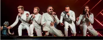  ?? — AP ?? (From left) Nick Carter, Brian Littrell, AJ McLean, Howie Dorough and Kevin Richardson of the Backstreet Boys perform during the Festival d’ete de Quebec, in Canada on Sunday.