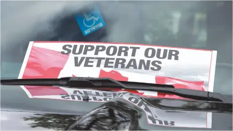  ?? CP PHOTO ?? A sign is placed on a truck windshield as members of the advocacy group Banished Veterans protest outside the Veterans Affairs office in Halifax on June 16.