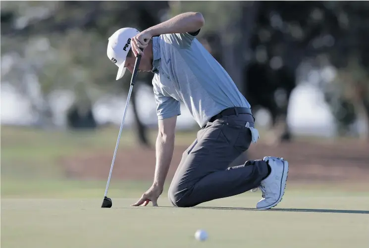  ?? — GETTY IMAGES ?? Canadian Mackenzie Hughes reacts after missing a putt on the 15th hole during the final round of the RSM Classic at Sea Island Resort Seaside Course on Sunday.