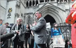  ?? Jonathan Brady ?? The Associated Press Rev. Patrick Mahoney from Washington, D.C., center, speaks to the media Sunday outside the Royal Courts of Justice in London, as he joins other supporters of 11-month-old Charlie Gard’s parents.