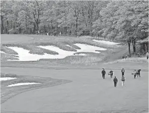  ?? PETER CASEY/USA TODAY SPORTS ?? Xander Schauffele walks on the fifth hole during a practice round Monday at Bethpage State Park’s Black Course.