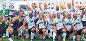  ?? COURTESY OF KEVON WILLIAMS ?? The Vatos at New Mexico Highlands celebrate their second straight national smallcolle­ge title in rugby.