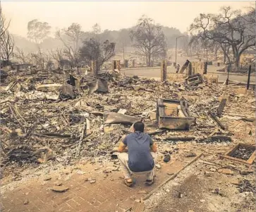  ?? Brian van der Brug Los Angeles Times ?? A HOMEOWNER surveys the rubble of his Santa Rosa home. Experts are questionin­g how climate change, recent drought and housing density could have played a role in Northern California’s fiercer wildfires.