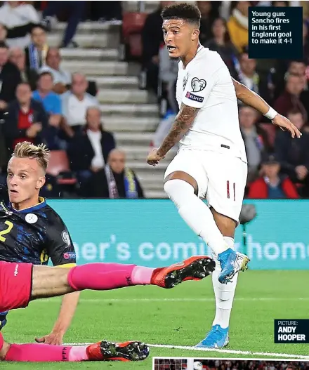  ?? AFP ?? Rising to the occasion: Sterling heads the equaliser as Kane looks on Young gun: Sancho fires in his first England goal to make it 4-1