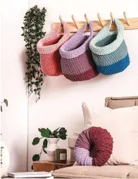  ?? ?? ■ Crocheted baskets made with Bernat's O'GO yarn are shown. Their website provides pattern and difficulty level for dozens of knitted and crocheted fashion and home items.