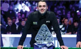  ?? Photograph: Richard Pelham/Getty Images ?? Ronnie O’Sullivan with the Paul Hunter Trophy after his 10-7 victory over Ali Carter in the Masters at Alexandra Palace.
