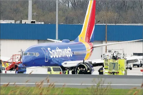  ?? Picture: AFP ?? BIG BLAST: A Southwest Airlines jet sits on the runway at Philadelph­ia Internatio­nal Airport after it was forced to land with an engine failure