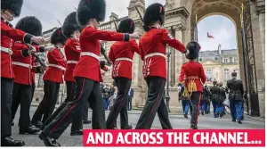  ?? ?? AND ACROSS THE CHANNEL...
Paris march: British soldiers arrive at the Elysee Palace