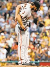  ?? KEITH SRAKOCIC/ASSOCIATED PRESS ?? Giants starter Madison Bumgarner tugs at his belt after giving up a solo home run to the Pirates’ Eric Kratz.